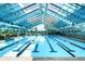 Bright and inviting indoor pool area with an open-air feel and well-maintained facilities at 18910 Augusta Dr, Monument, CO 80132