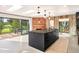 Modern kitchen with a large island, sleek countertops, and views of the golf course at 18910 Augusta Dr, Monument, CO 80132