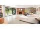 Living room with sliding glass doors, fireplace, and modern furnishings for a bright space at 18910 Augusta Dr, Monument, CO 80132