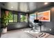 Modern office space featuring a sleek desk, comfortable chair, and a large window with scenic views at 18910 Augusta Dr, Monument, CO 80132