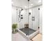 Modern walk-in shower features stylish tile, glass enclosure, and sleek fixtures, offering a luxurious spa experience at 18910 Augusta Dr, Monument, CO 80132