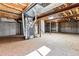 Unfinished basement with exposed beams and concrete walls awaits your personal touch at 9471 Crossland Way, Highlands Ranch, CO 80130