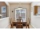 Dining room with natural light and wood table set at 9471 Crossland Way, Highlands Ranch, CO 80130