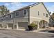 Exterior shot featuring attached garages and neutral siding, providing convenient parking at 9471 Crossland Way, Highlands Ranch, CO 80130