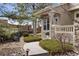 Charming front entrance with stone accents and lush landscaping at 9471 Crossland Way, Highlands Ranch, CO 80130