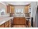 Functional kitchen with ample cabinet space and stainless steel appliances at 9471 Crossland Way, Highlands Ranch, CO 80130