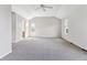 Spacious main bedroom featuring a vaulted ceiling and plush carpet at 9471 Crossland Way, Highlands Ranch, CO 80130