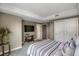 Comfortable bedroom with soft neutral color palette, media center and plenty of storage at 85 Rampart Way # 206, Denver, CO 80230