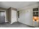 Cozy bedroom shows gray carpet and a white, built-in unit with ample storage at 85 Rampart Way # 206, Denver, CO 80230