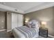 Comfortable bedroom with soft neutral color palette, decorative lamps and plenty of storage at 85 Rampart Way # 206, Denver, CO 80230