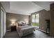 Inviting bedroom with soft natural light and decorative lamps at 85 Rampart Way # 206, Denver, CO 80230
