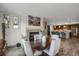 Bright dining area featuring a fireplace with views to the modern kitchen with island at 85 Rampart Way # 206, Denver, CO 80230