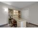 Bright office featuring a built-in desk and shelves, with a view of a closet at 85 Rampart Way # 206, Denver, CO 80230