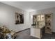 Office space with a desk, custom shelving, and comfortable seating at 85 Rampart Way # 206, Denver, CO 80230