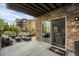 Relaxing outdoor patio with comfortable seating and views of the surrounding landscape at 85 Rampart Way # 206, Denver, CO 80230