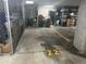 Numbered storage unit located in the parking garage is enclosed with chain link fencing at 85 Rampart Way # 206, Denver, CO 80230