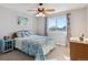 Cozy bedroom with natural light from the window, and blue accents at 2460 Switch Grass Way, Castle Rock, CO 80109
