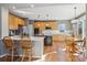 Bright, updated kitchen featuring light wood cabinets, stainless steel appliances, and a breakfast nook at 2460 Switch Grass Way, Castle Rock, CO 80109