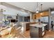 Spacious kitchen with a breakfast nook that opens up to a cozy living room with fireplace at 2460 Switch Grass Way, Castle Rock, CO 80109