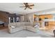 Spacious living room with hardwood floors, neutral colors, and open to the kitchen at 2460 Switch Grass Way, Castle Rock, CO 80109
