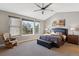 Serene main bedroom with vaulted ceiling, large window, and plush carpet at 2460 Switch Grass Way, Castle Rock, CO 80109