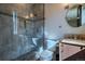 Modern bathroom boasts glass shower, stylish vanity, and serene ambiance for relaxation at 1745 N Emerson St, Denver, CO 80218