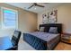 Comfortable bedroom with natural light, a ceiling fan, and stylish decor at 1745 N Emerson St, Denver, CO 80218