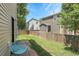 Cozy backyard with lawn and a patio is the perfect place to kick back and relax in the summer at 11757 W Tufts Pl, Morrison, CO 80465