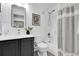 Bathroom vanity and sink are a modern style and has a bathtub with shower at 11757 W Tufts Pl, Morrison, CO 80465