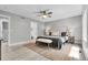 Spacious bedroom has a connecting bathroom and a ceiling fan to keep the room cool and comfortable at 11757 W Tufts Pl, Morrison, CO 80465