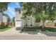 Charming home with a light blue front door, attached garage, and landscaped front yard at 11757 W Tufts Pl, Morrison, CO 80465