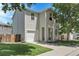 Two-story home featuring an attached garage, green lawn, and a welcoming front entrance at 11757 W Tufts Pl, Morrison, CO 80465