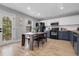 Eat-in kitchen with modern appliances, an exterior door and lots of natural light at 11757 W Tufts Pl, Morrison, CO 80465