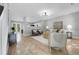 Bright and open living room featuring hardwood floors and modern furniture at 11757 W Tufts Pl, Morrison, CO 80465