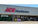 This image shows the exterior of an Ace Hardware store with bags of supplies out front, under the prominent logo at 5251 Altura St, Denver, CO 80239