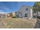Large, well-maintained backyard featuring a patio, shed, and mature landscaping at 5251 Altura St, Denver, CO 80239