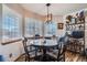 Charming breakfast nook with bright windows and a stylish light fixture above the table at 5251 Altura St, Denver, CO 80239