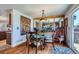 Elegant dining room with hardwood floors and a decorative mirror at 5251 Altura St, Denver, CO 80239