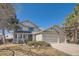 Charming two-story home with a three-car garage and covered front porch at 5251 Altura St, Denver, CO 80239