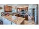 Beautiful kitchen featuring granite countertops, stainless steel appliances, and wood cabinets at 5251 Altura St, Denver, CO 80239