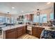 Spacious kitchen showcasing granite countertops, wood cabinets, and ample counter space at 5251 Altura St, Denver, CO 80239