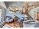 Stylish living room featuring a staircase and decorative artwork on the wall at 5251 Altura St, Denver, CO 80239