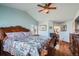 A spacious main bedroom features wood floors, a ceiling fan and bathroom access at 5251 Altura St, Denver, CO 80239