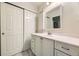 This bathroom has a spacious vanity with storage and a large mirror, next to a closet at 8208 S High Ct, Centennial, CO 80122