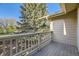 Deck with painted white wood railing offering views of the community landscaping at 8208 S High Ct, Centennial, CO 80122