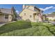 A well-maintained home with a lush green lawn, showcasing its charming curb appeal and exterior features at 8208 S High Ct, Centennial, CO 80122