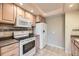 A kitchen equipped with appliances, cabinets, and ample counter space at 8208 S High Ct, Centennial, CO 80122