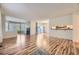 Open-concept living room with hardwood floors, fireplace, and a bright, airy atmosphere at 8208 S High Ct, Centennial, CO 80122