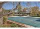 A community pool is covered for the off season, with a gazebo and recreational space, surrounded by fall foliage at 8208 S High Ct, Centennial, CO 80122
