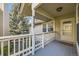 View of the front porch with house number, showing the entrance and outdoor space at 8208 S High Ct, Centennial, CO 80122
